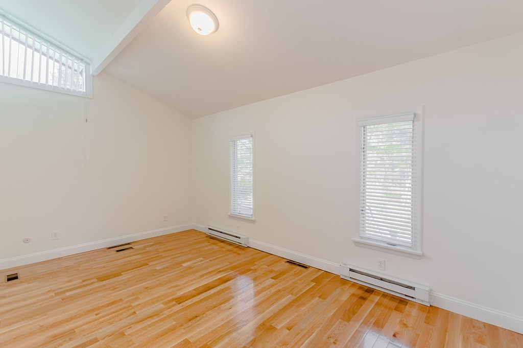 264 Country Way Needham, MA 02492 - Photo 21 of 29 an empty room with a window