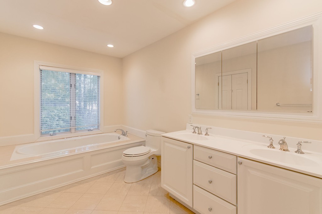 264 Country Way Needham, MA 02492 - Photo 22 of 29 a bathroom with a toilet a sink and bathtub