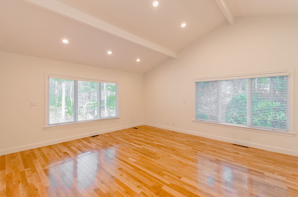 264 Country Way Needham, MA 02492 - Photo 23 of 29 a view of an empty room with wooden floor and a window