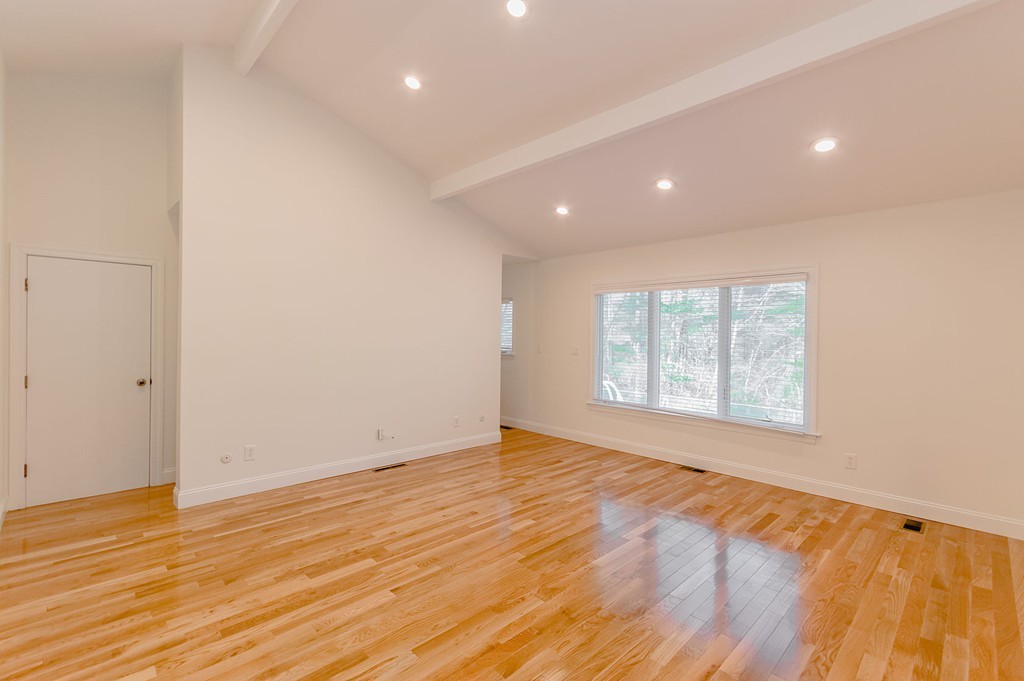 264 Country Way Needham, MA 02492 - Photo 24 of 29 an empty room with wooden floor and windows