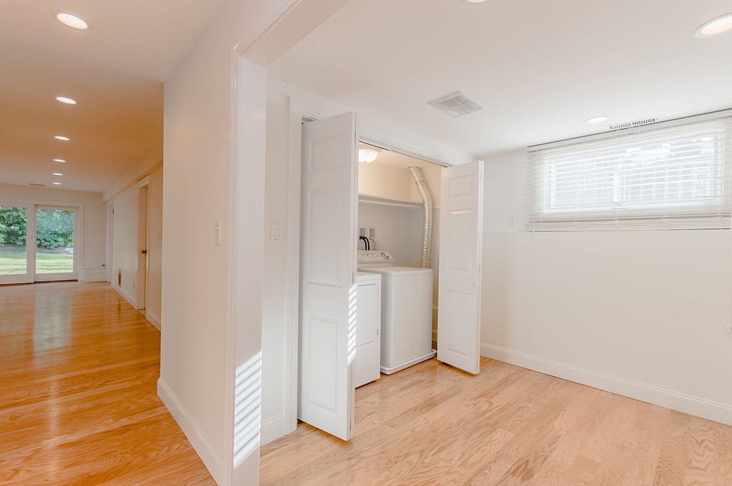 264 Country Way Needham, MA 02492 - Photo 3 of 29 wooden floor in an empty room with a window