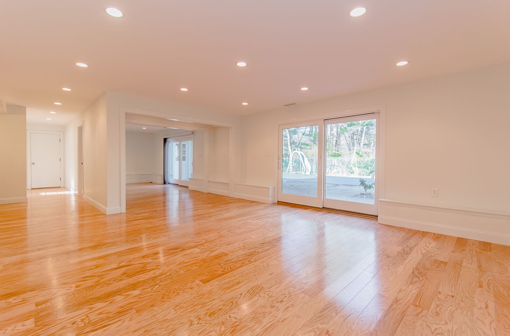 264 Country Way Needham, MA 02492 - Photo 7 of 29 a view of an empty room with wooden floor and a window
