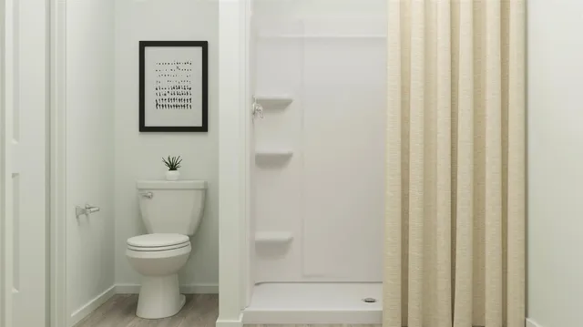 an aerial view of residential houses with outdoor space and ocean view