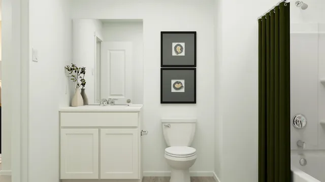 a bedroom with a bed and painting on the wall