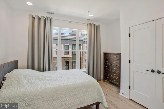 a bedroom with a bed and a closet