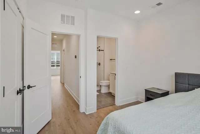 a bedroom with a bed and a table