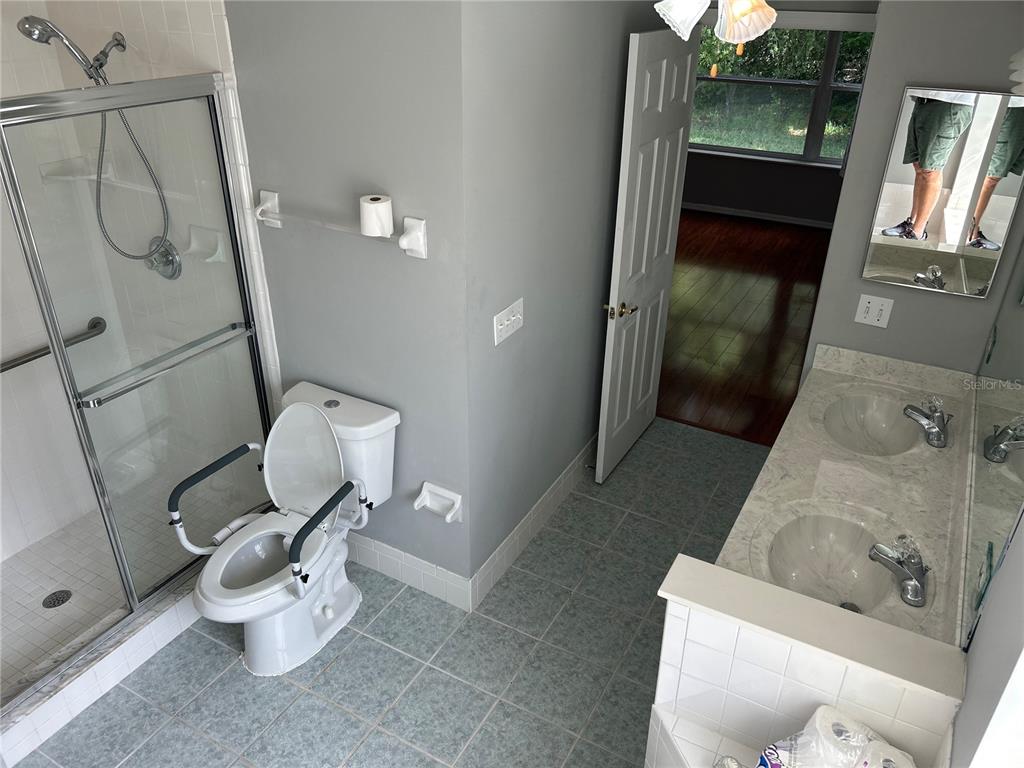 11014 Southwest 73rd Circle Ocala, FL 34476 - Photo 12 of 25 a bathroom with a sink and toilet