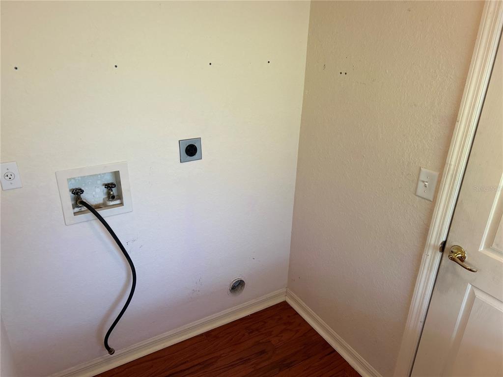 11014 Southwest 73rd Circle Ocala, FL 34476 - Photo 18 of 25 a room with wooden floor and white walls