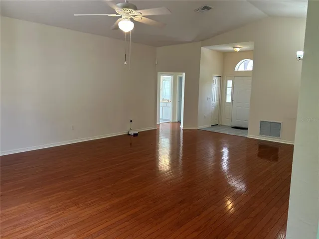 a view of a livingroom with wooden floor