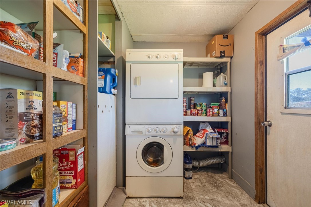 1315 Sunset Trail LaBelle, FL 33935 - Photo 13 of 23 a utility room with dryer and washer