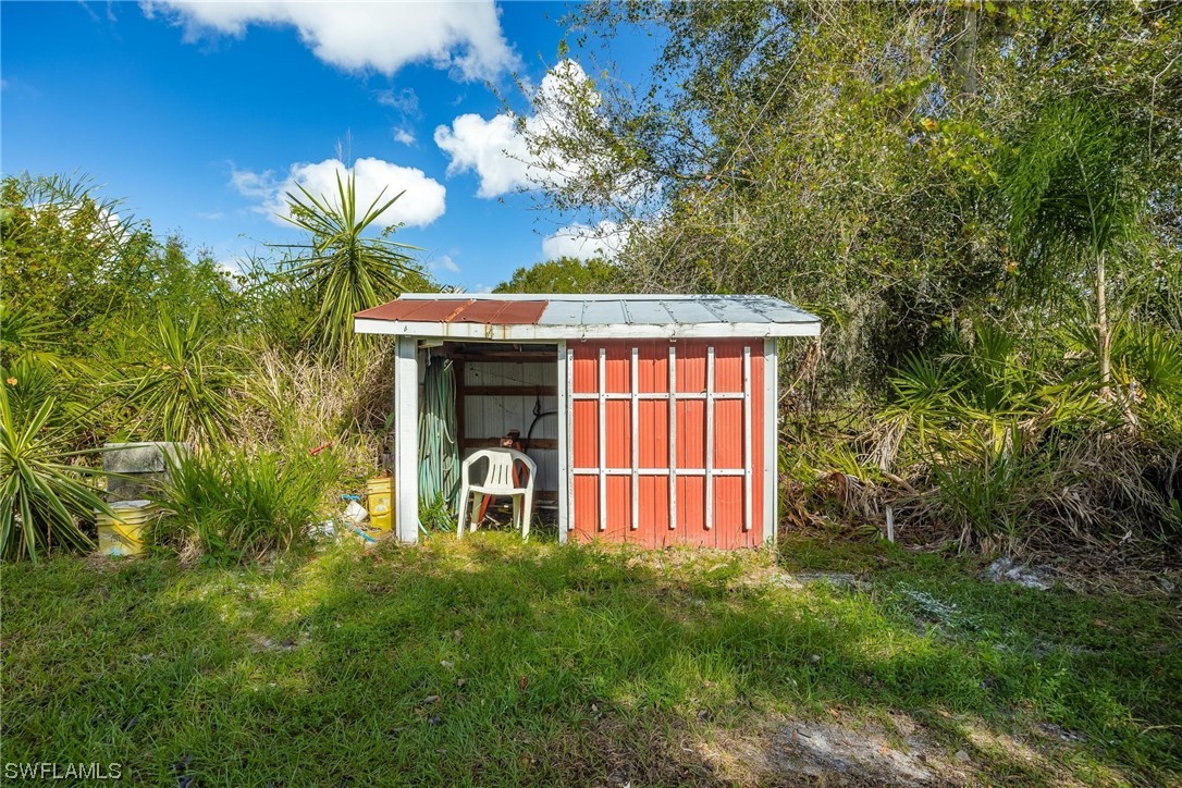 1315 Sunset Trail LaBelle, FL 33935 - Photo 17 of 23 a view of a house with balcony and garden