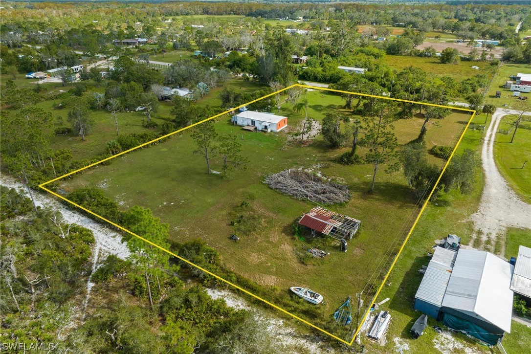 1315 Sunset Trail LaBelle, FL 33935 - Photo 23 of 23 an aerial view of residential houses with outdoor space