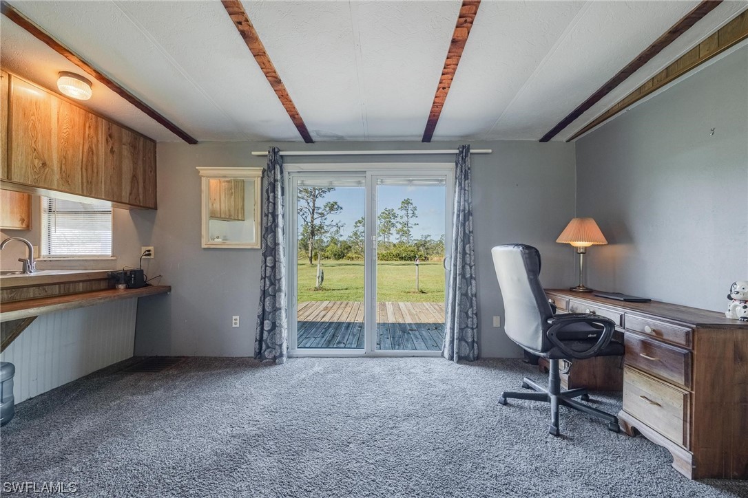 1315 Sunset Trail LaBelle, FL 33935 - Photo 8 of 23 a view of a workspace with furniture and a window