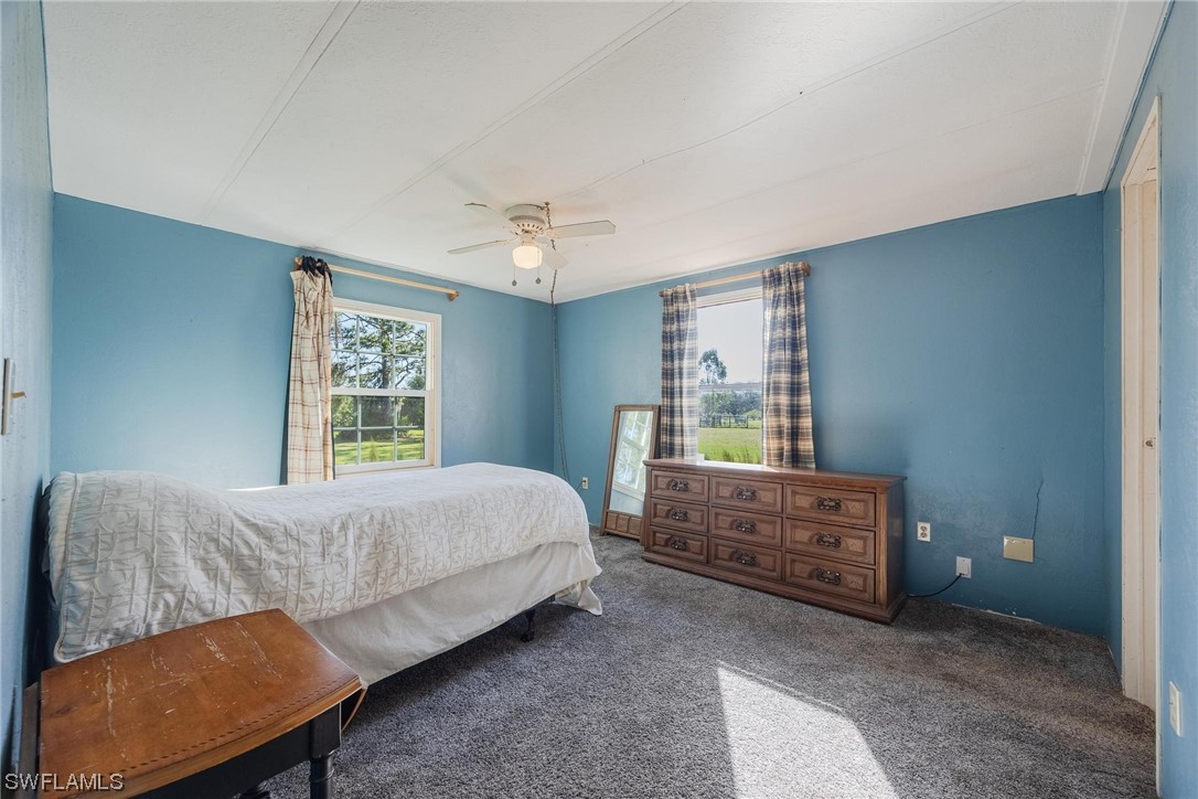 1315 Sunset Trail LaBelle, FL 33935 - Photo 9 of 23 a bed room with a bed and a window