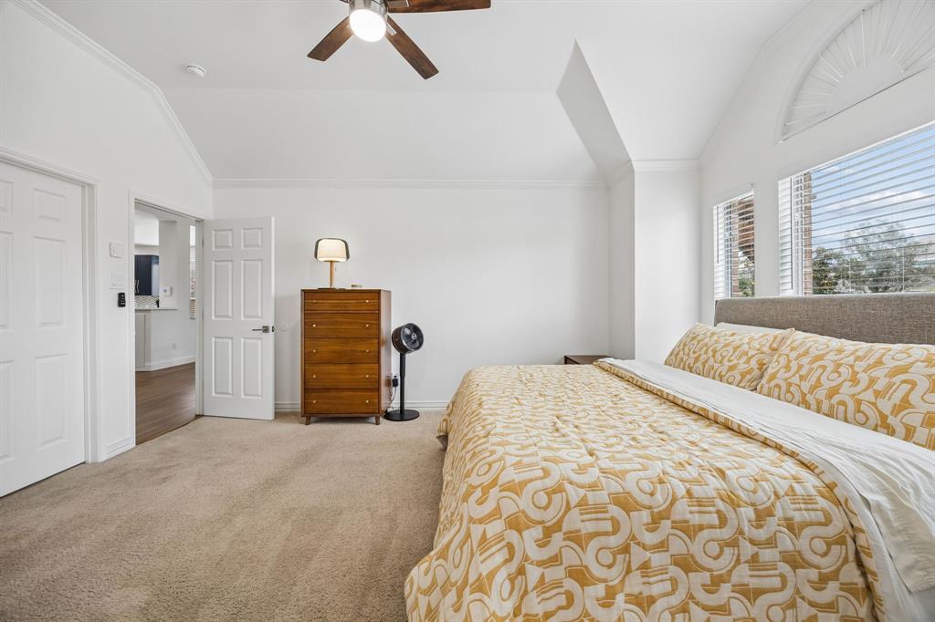 9217 Inverness Drive Rowlett, TX 75089 - Photo 19 of 40 Bright and Spacious Owner’s Suite — Natural light, high ceilings, and a roomy footprint give this bedroom a relaxing sense of space at the end of the day.