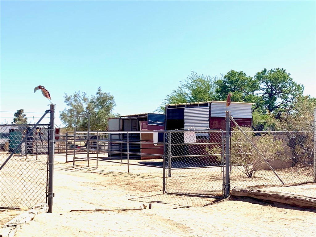 56965 Camulos Road Landers, CA 92285 - Photo 20 of 26 Three horse corrals with 3 sided shelters and roofs