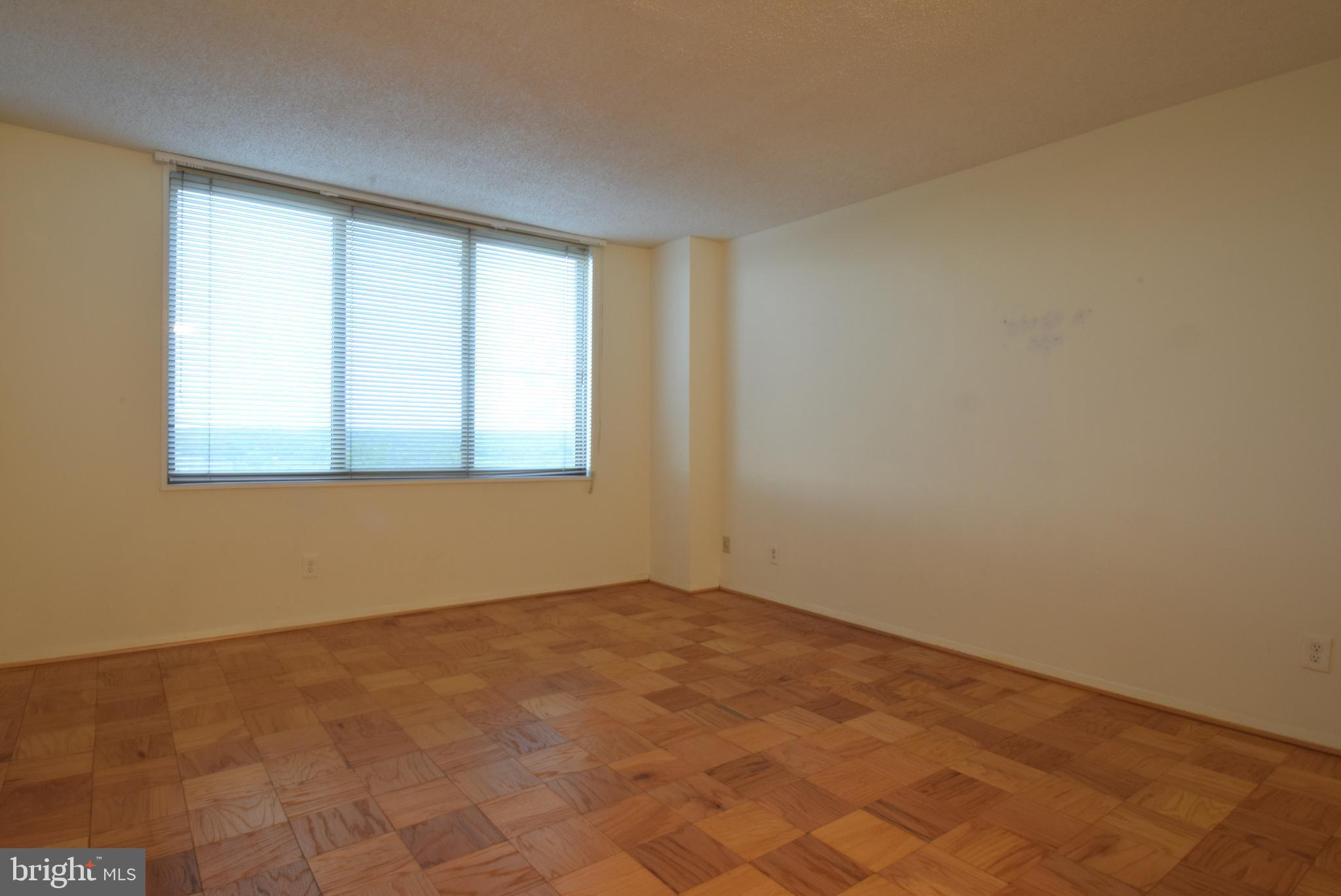 5225 Pooks Hill Road, Unit 1512N Bethesda, MD 20814 - Photo 11 of 26 an empty room with a window