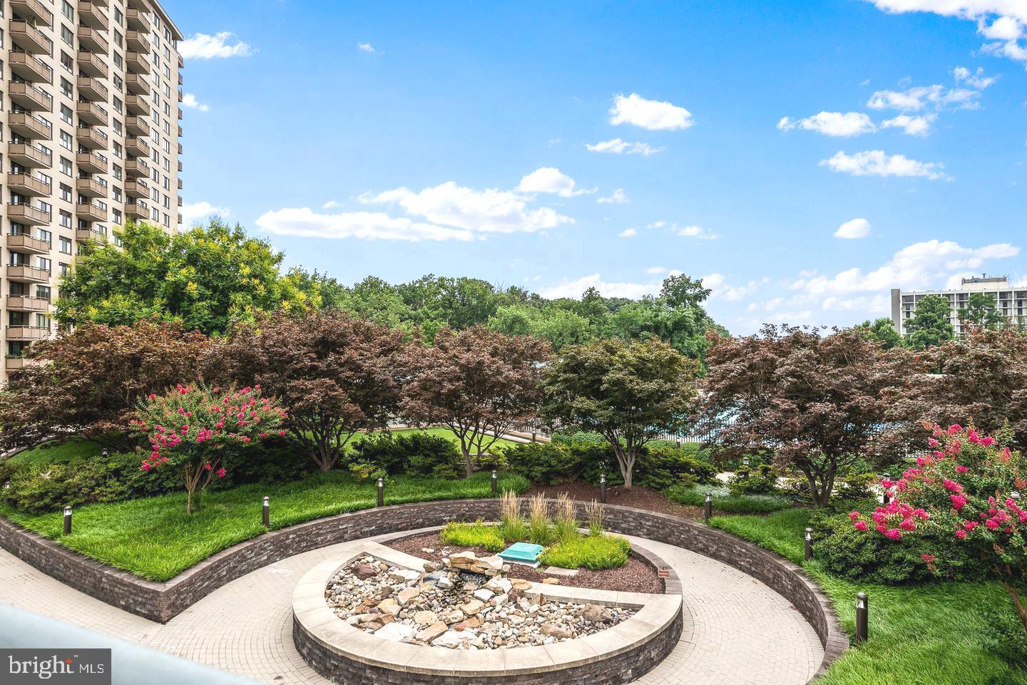 5225 Pooks Hill Road, Unit 1512N Bethesda, MD 20814 - Photo 26 of 26 a view of a swimming pool with a garden