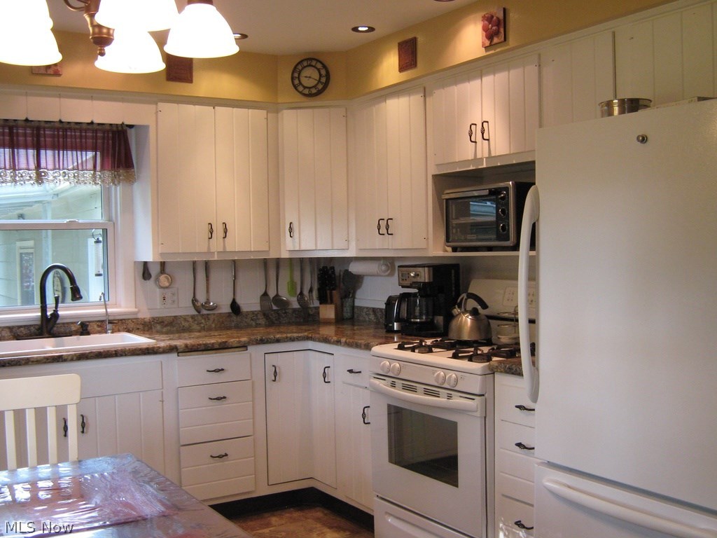 4625 Roop Avenue Barberton, OH 44203 - Photo 4 of 18 Bright and Efficient Kitchen with Appliances(Range, Dishwasher, Fridge, Garbage disposal too)