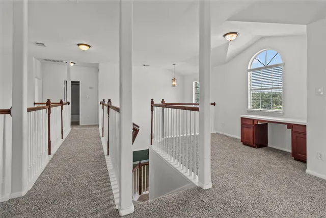 a view of a livingroom with a kitchen