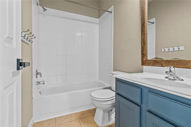 a view of an empty room with a fan