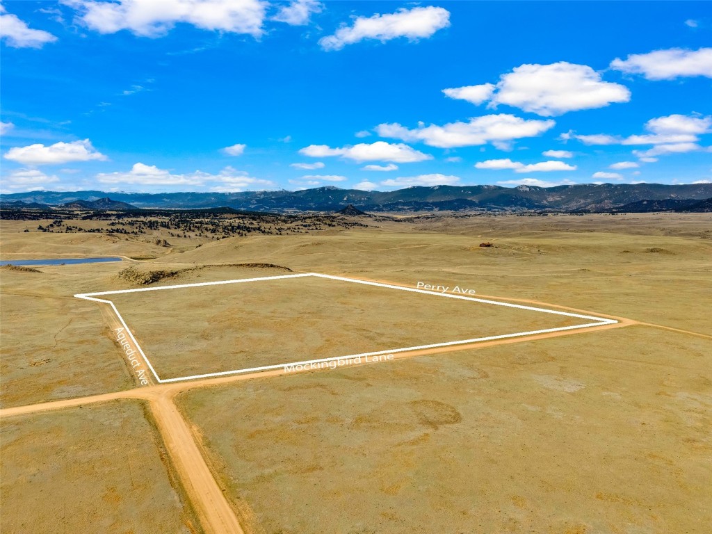 Tbd Tbd Mockingbird Lane Como, CO 80432 - Photo 10 of 12 Aerial view of sparsely populated area featuring a mountain backdrop and property boundaries highlighted