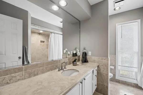 a bathroom with a bathtub and a shower