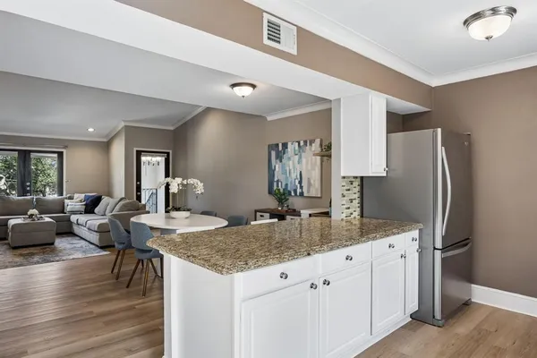 a kitchen with a table and chairs in it