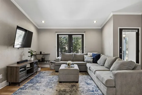 a living room with furniture and a large window