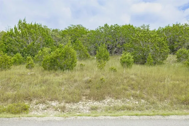 a front view of a building with water view