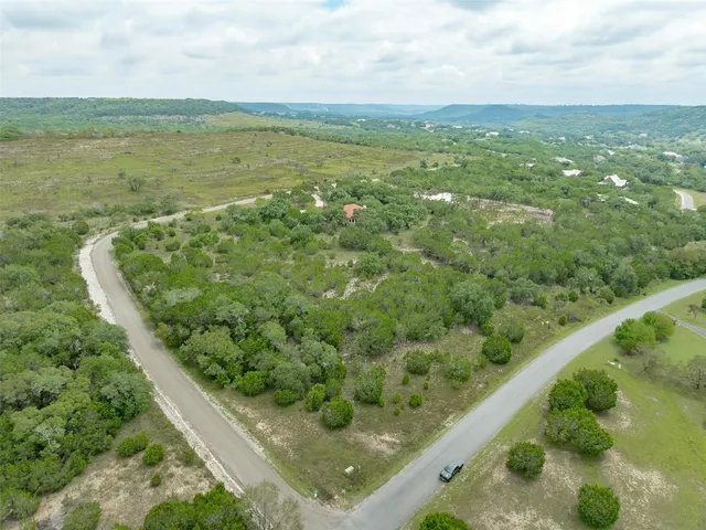 a view of a field with an ocean