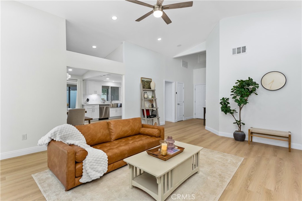 304 North Dearborn Street Redlands, CA 92374 - Photo 11 of 39 a living room with furniture gym equipment and a rug