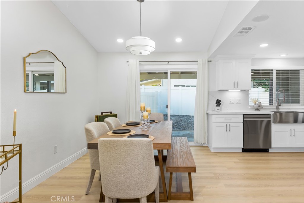 304 North Dearborn Street Redlands, CA 92374 - Photo 12 of 39 a view of a dining room with furniture window and wooden floor