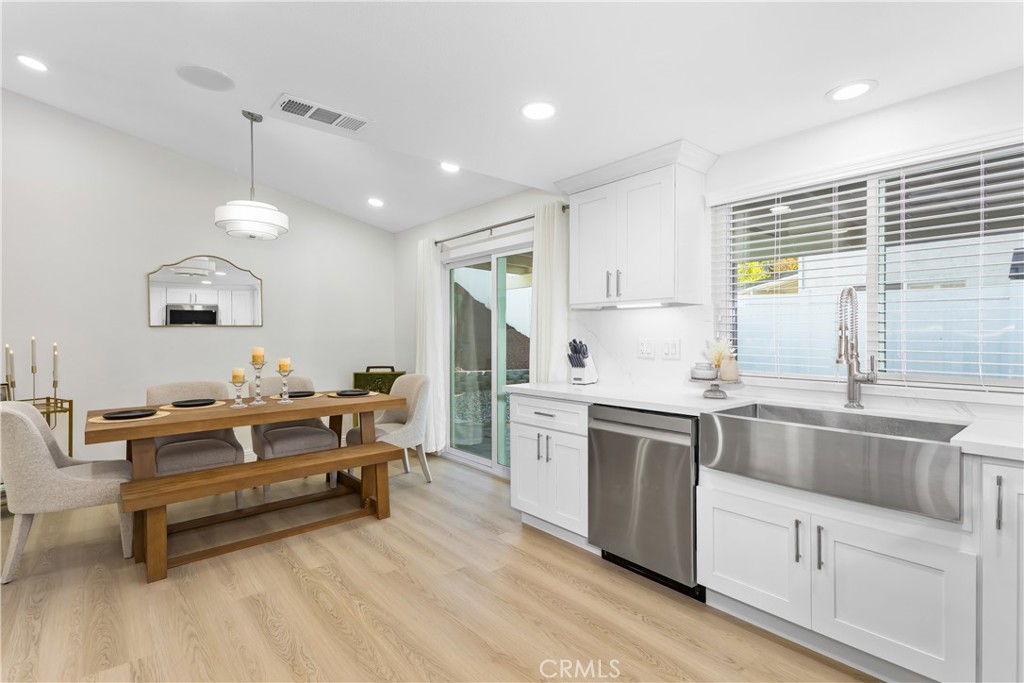 304 North Dearborn Street Redlands, CA 92374 - Photo 16 of 39 a kitchen with kitchen island stainless steel appliances a stove a sink a refrigerator and cabinets