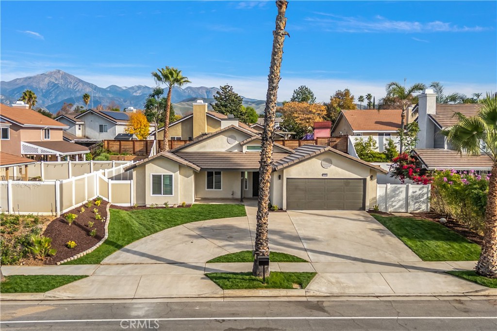304 North Dearborn Street Redlands, CA 92374 - Photo 2 of 39 a front view of a house with a garden and plants