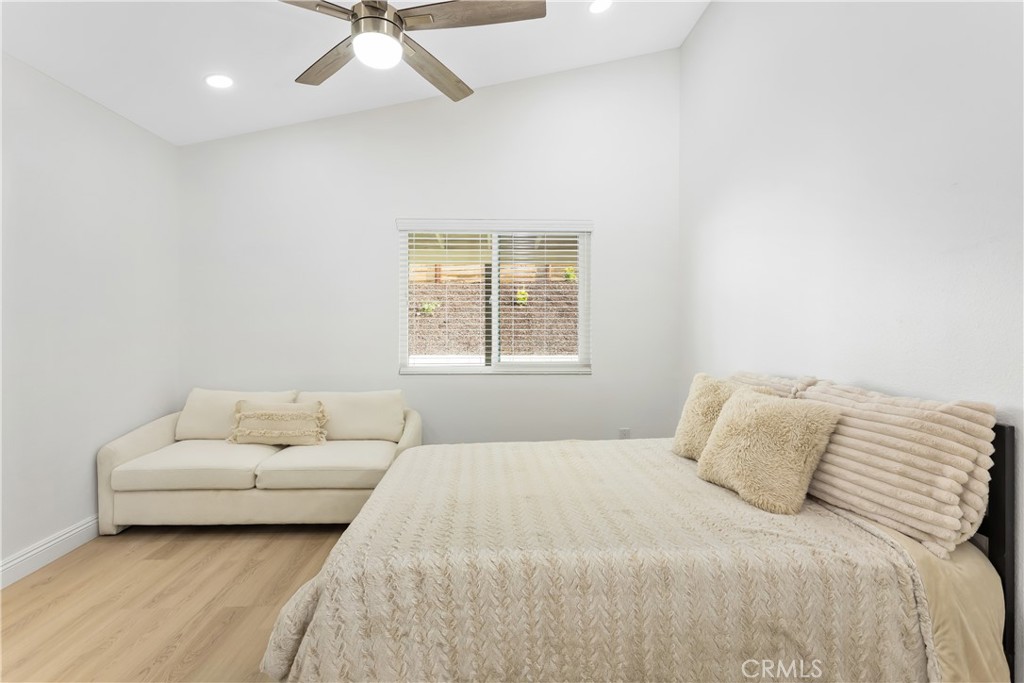304 North Dearborn Street Redlands, CA 92374 - Photo 22 of 39 a bedroom with a bed furniture and white walls