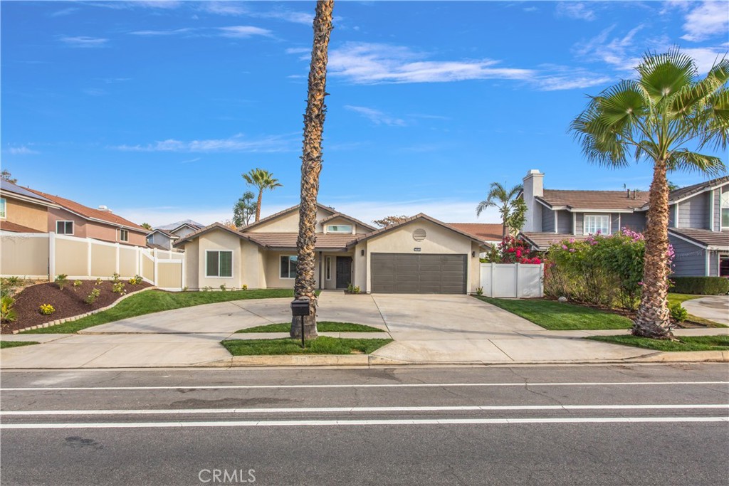 304 North Dearborn Street Redlands, CA 92374 - Photo 3 of 39 a front view of a house with garden and porch