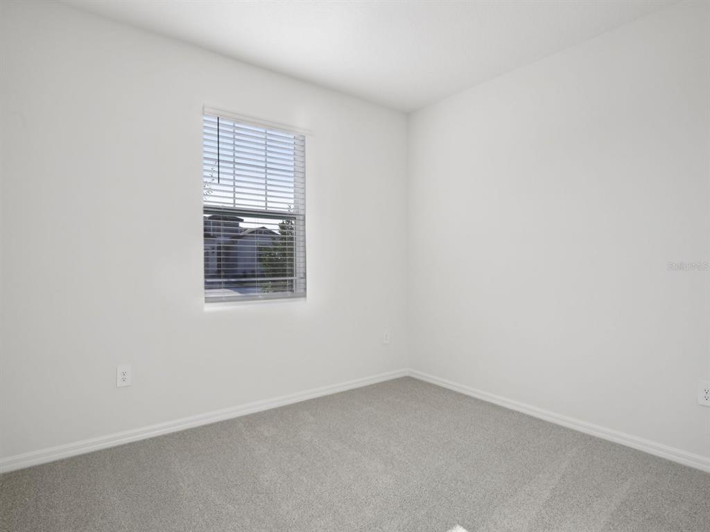 13311 Shellmore Avenue Palmetto, FL 34221 - Photo 16 of 46 an empty room with a window