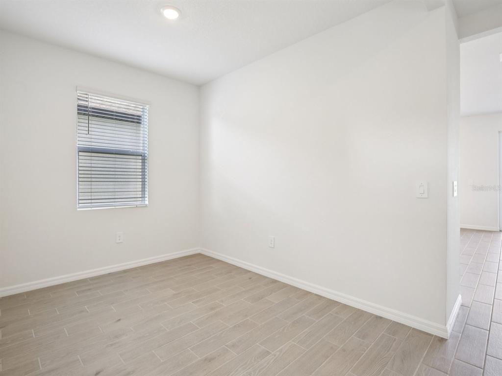 13311 Shellmore Avenue Palmetto, FL 34221 - Photo 19 of 46 a view of an empty room with a window