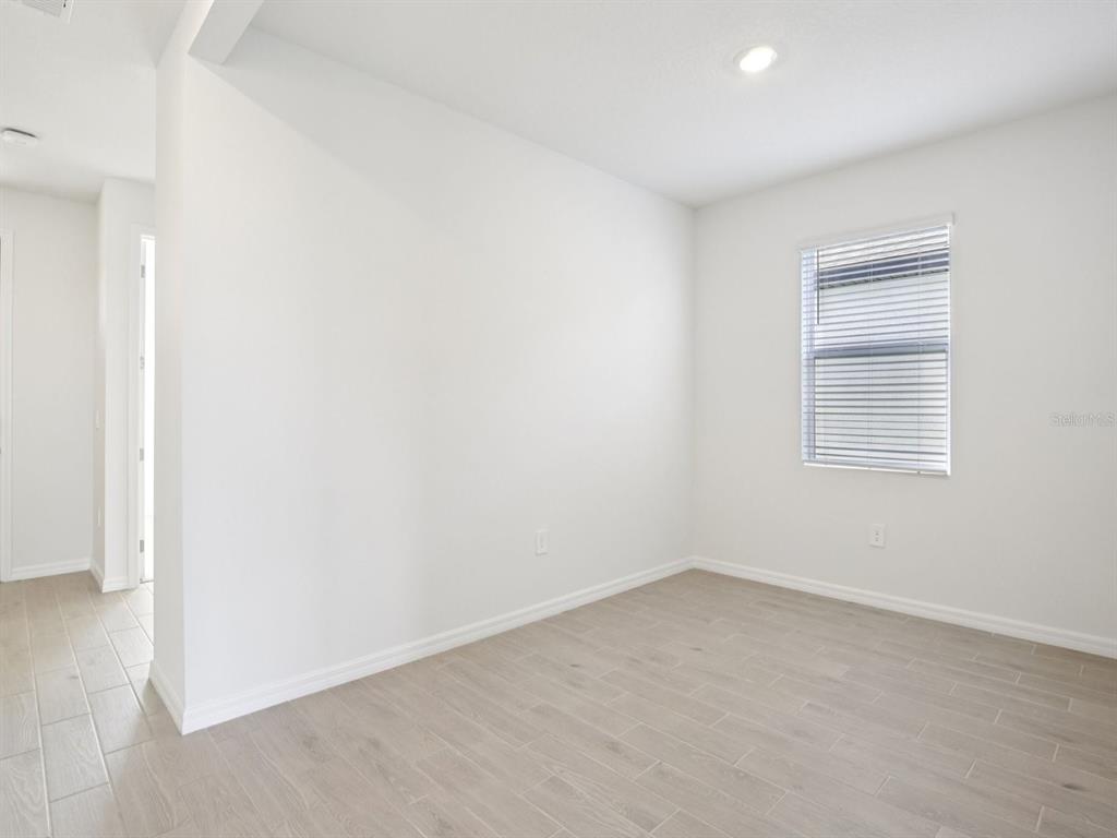 13311 Shellmore Avenue Palmetto, FL 34221 - Photo 20 of 46 an empty room with a window