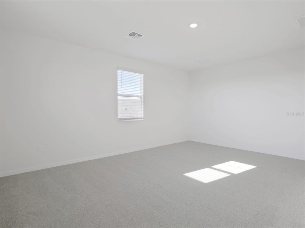 13311 Shellmore Avenue Palmetto, FL 34221 - Photo 24 of 46 an empty room with a empty space and window