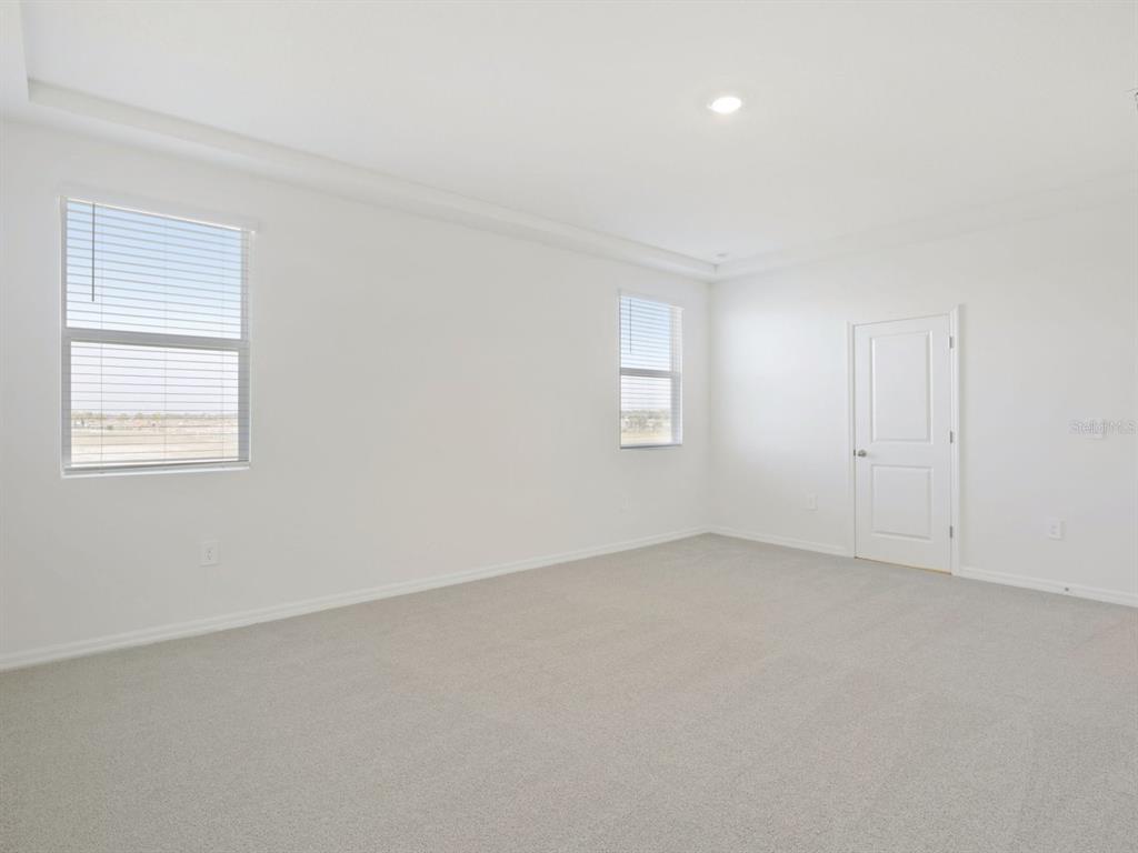 13311 Shellmore Avenue Palmetto, FL 34221 - Photo 26 of 46 an empty room with windows