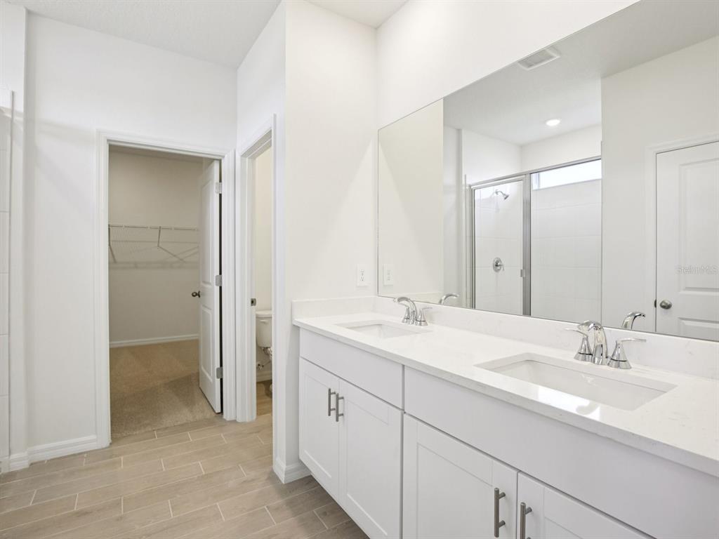 13311 Shellmore Avenue Palmetto, FL 34221 - Photo 29 of 46 a bathroom with a sink and a mirror