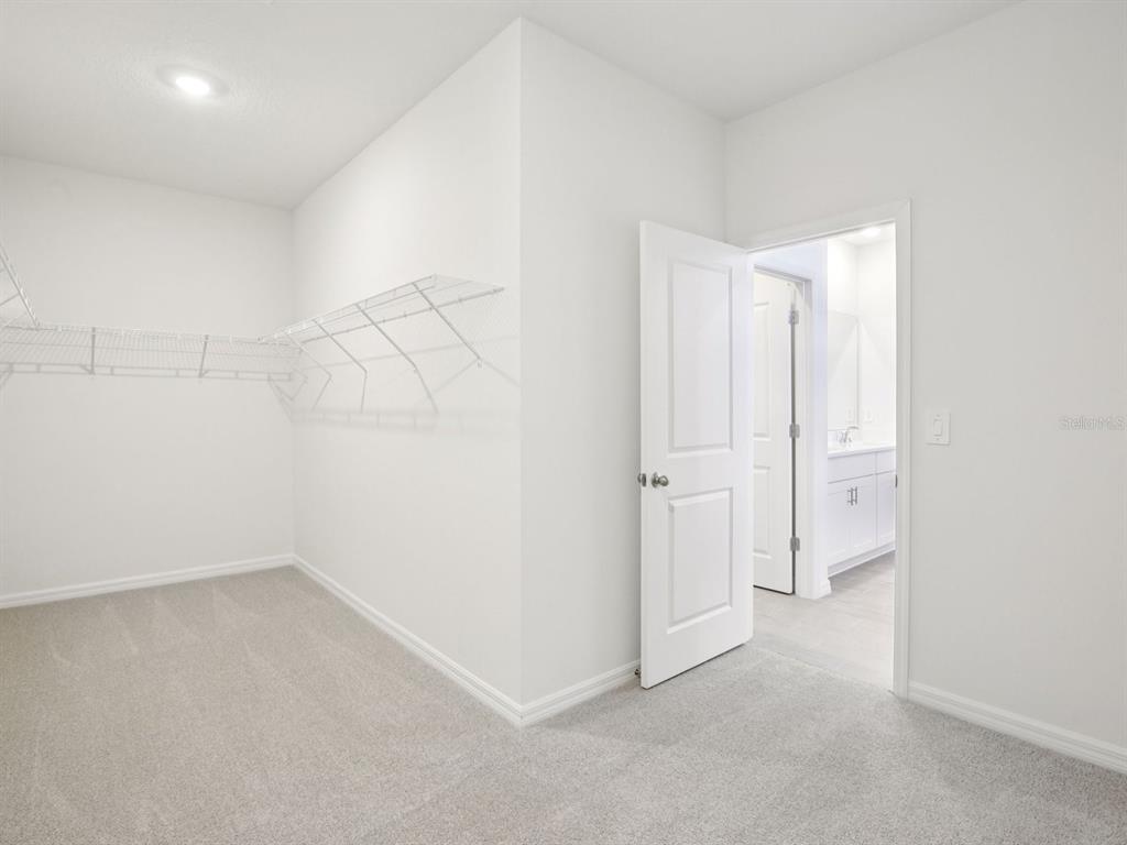 13311 Shellmore Avenue Palmetto, FL 34221 - Photo 32 of 46 wooden floor and cabinet in a room