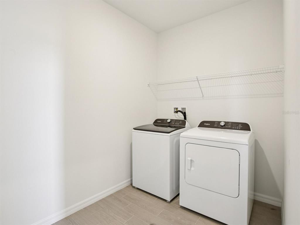 13311 Shellmore Avenue Palmetto, FL 34221 - Photo 34 of 46 a utility room with dryer and washer