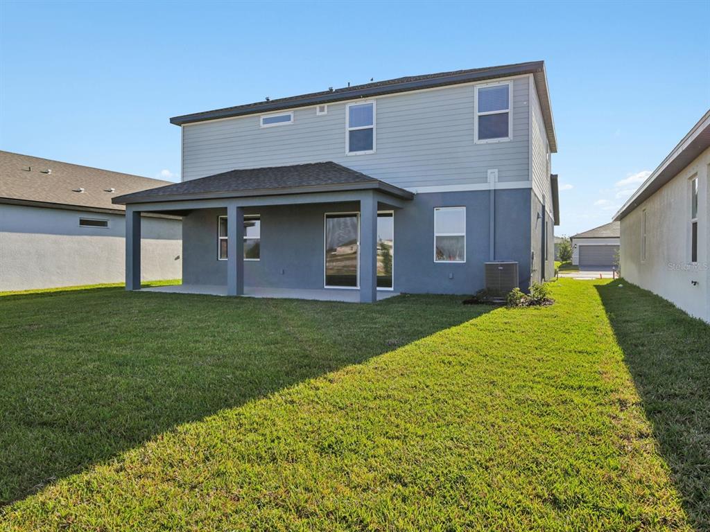 13311 Shellmore Avenue Palmetto, FL 34221 - Photo 44 of 46 a front view of house with yard