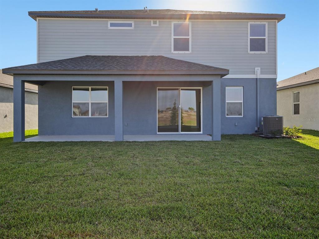 13311 Shellmore Avenue Palmetto, FL 34221 - Photo 45 of 46 a front view of a house with garden