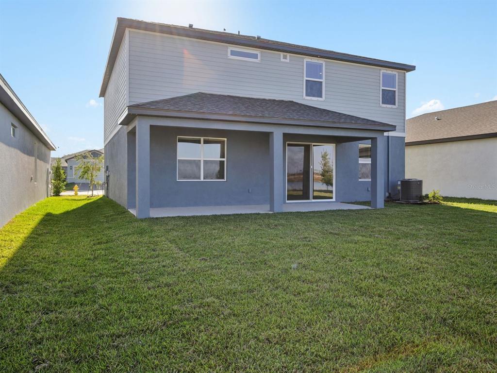 13311 Shellmore Avenue Palmetto, FL 34221 - Photo 46 of 46 a front view of a house with a garden
