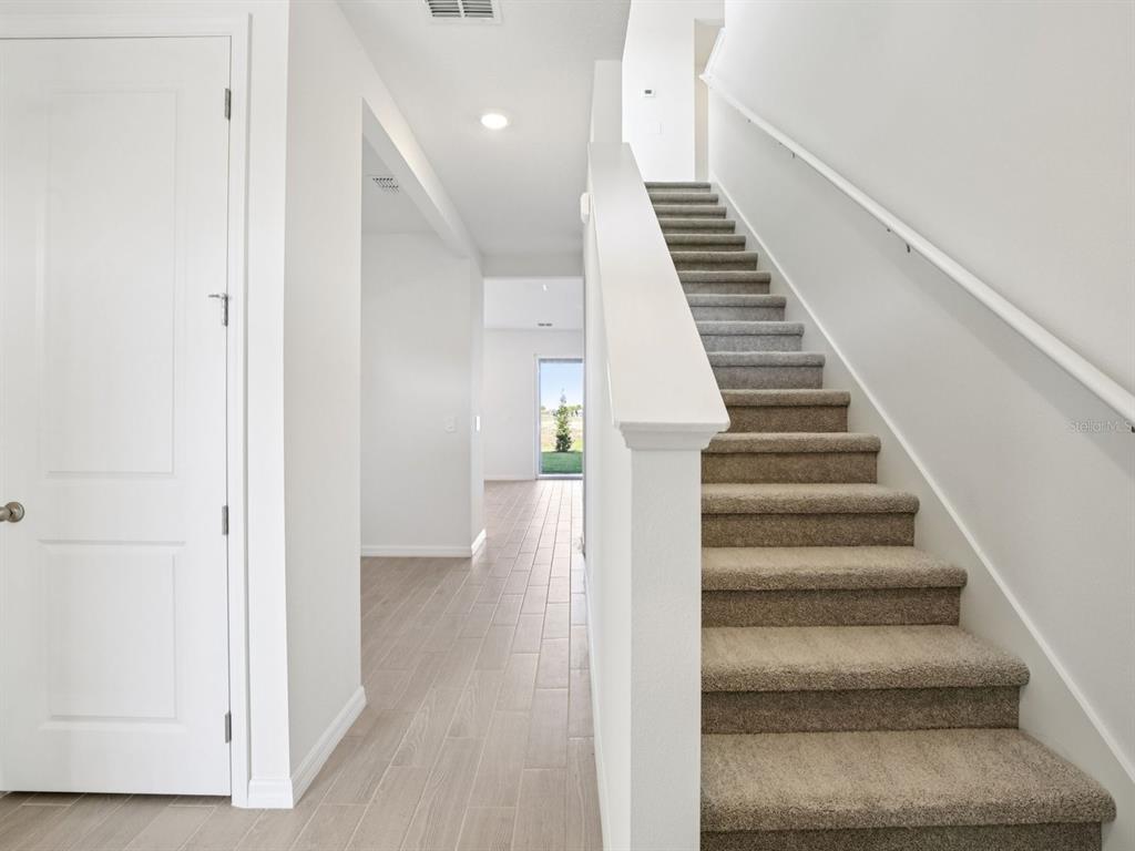 13311 Shellmore Avenue Palmetto, FL 34221 - Photo 5 of 46 a view of an entryway with wooden floor