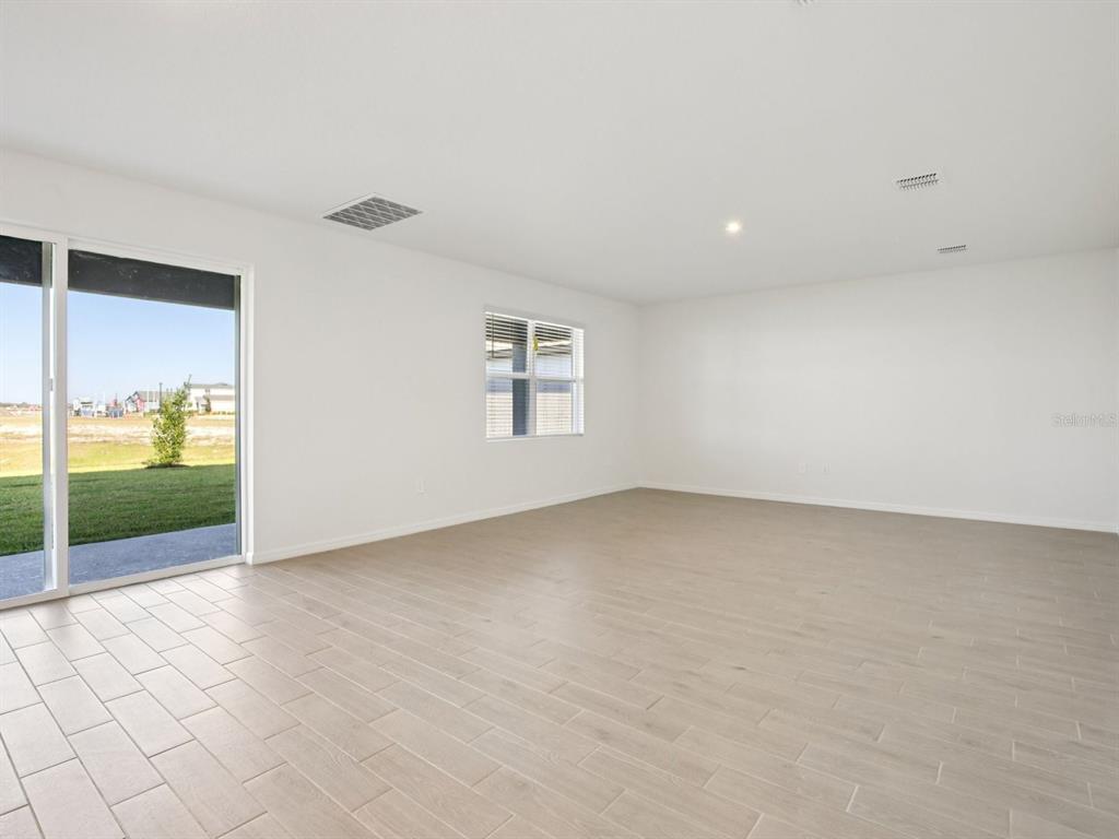 13311 Shellmore Avenue Palmetto, FL 34221 - Photo 6 of 46 an empty room with windows